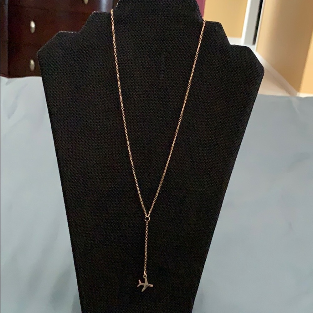 Gold tone airplane necklace